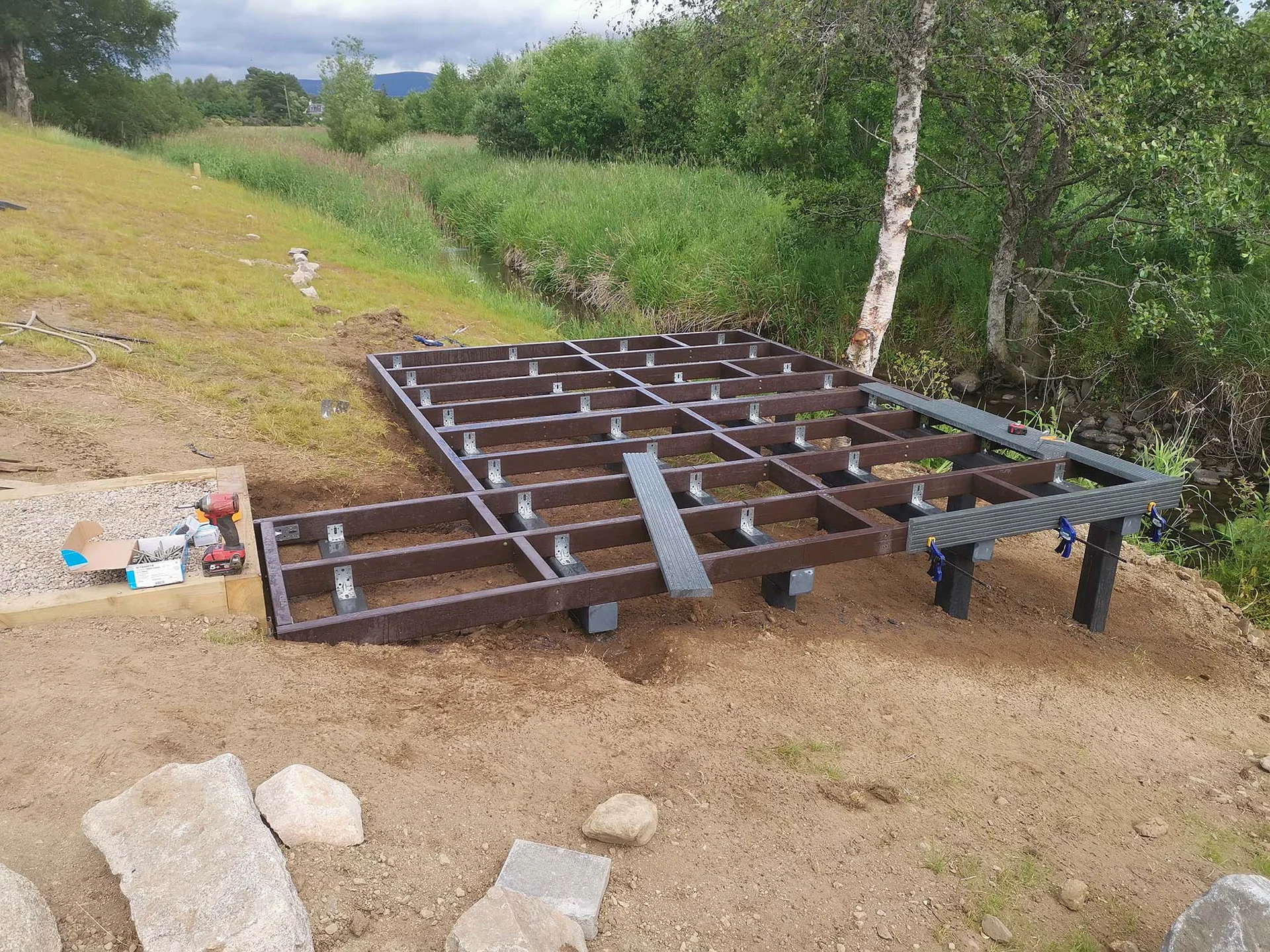 Recycled plastic decking installation in UK garden